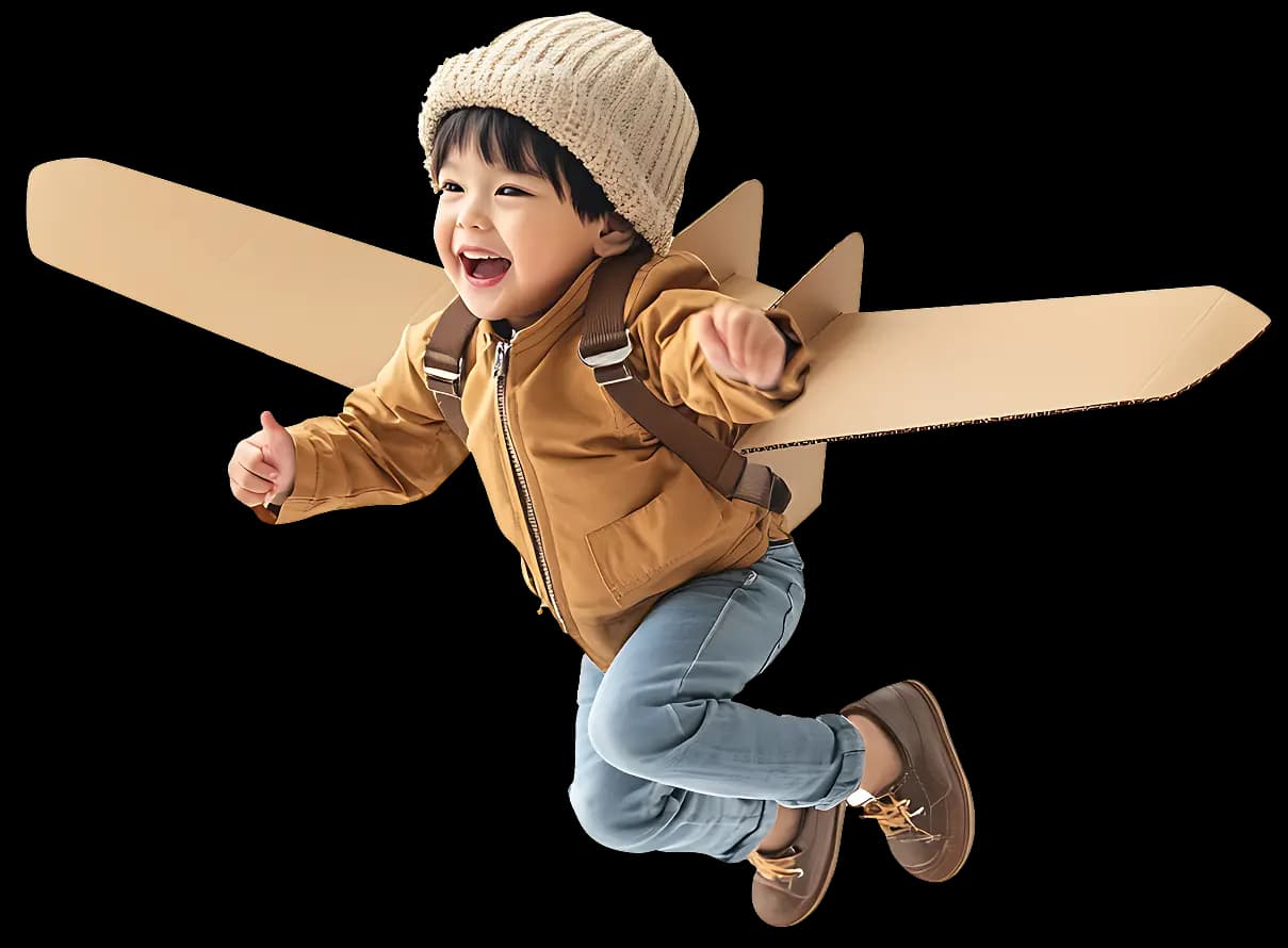 A joyful child with cardboard wings, ready to soar